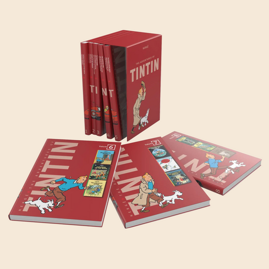 The Adventures of Tintin 8-Book Box Set (Compact Edition) by Innovative Books is displayed, with upright red hardcovers in the box and three volumes laid out to reveal covers showing Tintin with his dog Snowy.