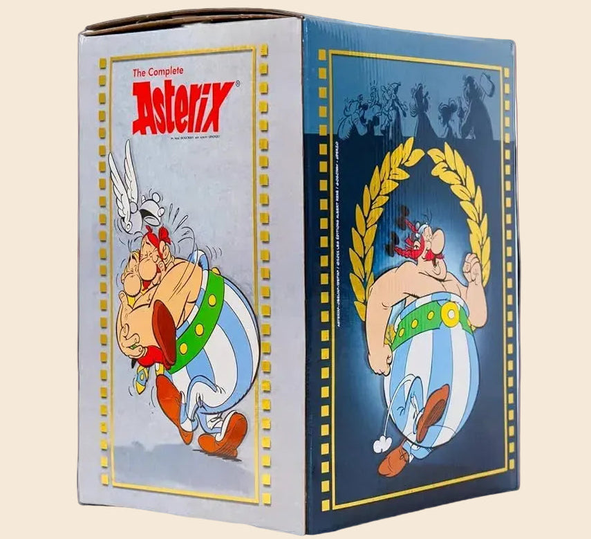 The Complete Asterix 39-Book Box Set, a large paperback collection with colorful illustrations of Asterix on a blue and white slipcase.